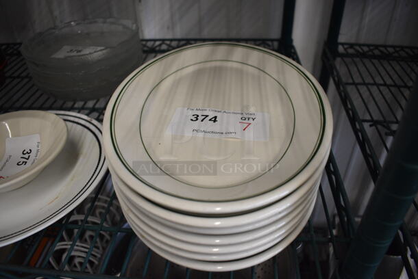 7 White Ceramic Oval Plates w/ Green Lines on Rim. 12.5x9x1. 7 Times Your Bid!