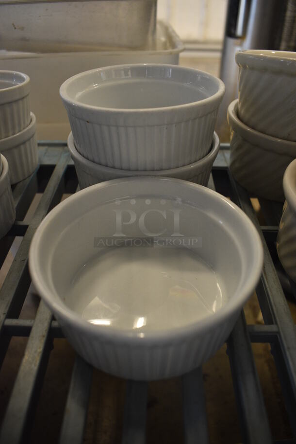 4 White Ceramic Bowls. 4x4x2. 4 Times Your Bid!