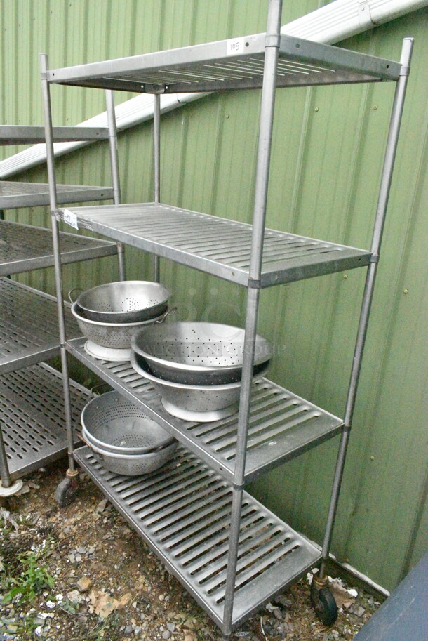 Metal 4 Tier Shelving Unit w/ Contents Including Colanders. BUYER MUST DISMANTLE. PCI CANNOT DISMANTLE FOR SHIPPING. PLEASE CONSIDER FREIGHT CHARGES.
 - Image 2 of 9