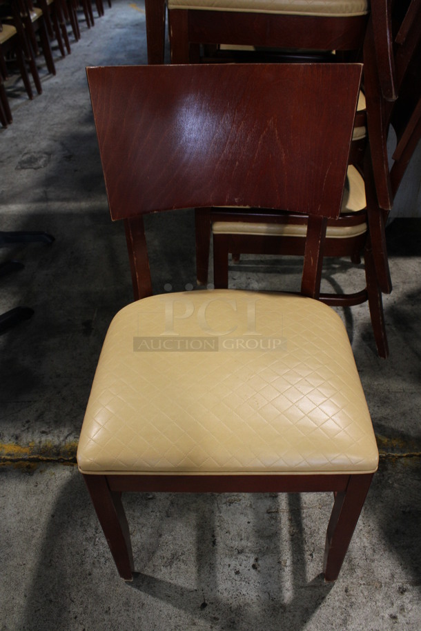 14 Wooden Dining Chairs w/ Tan Quilted Pattern Seat Cushions. Stock Picture - Cosmetic Condition May Vary. 19x21x36. 14 Times Your Bid!
