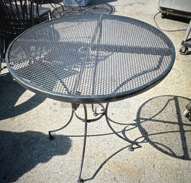 One Black Metal Round Patio Table With Umbrella Hole. 48X29