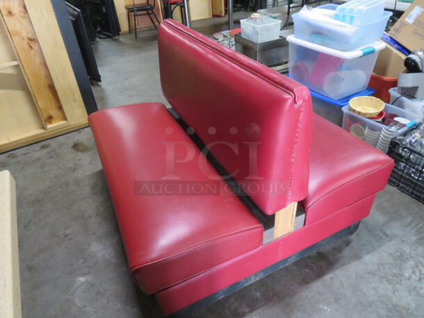 One Double Sided Booth With Red Cushioned Seat And Back. 48X46X36