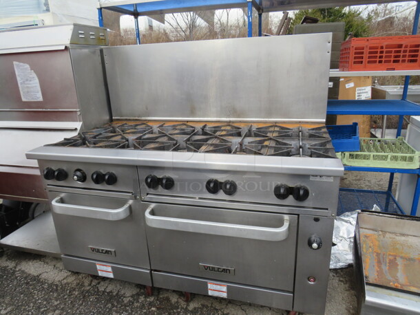 One SS Vulcan 10 Burner Natural Gas Range On Casters. Model# 60SS-10BN. 60X34.5X58. Working When Removed.