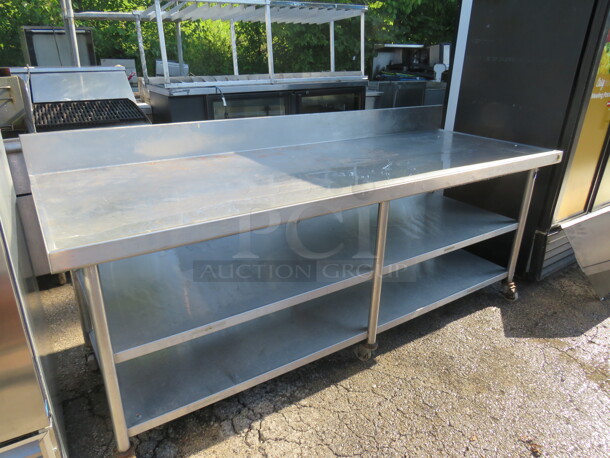 One Stainless Steel Table With 2 Stainless Steel Under Shelves, Back Splash, On Casters. 90X32X39 - Image 1 of 2