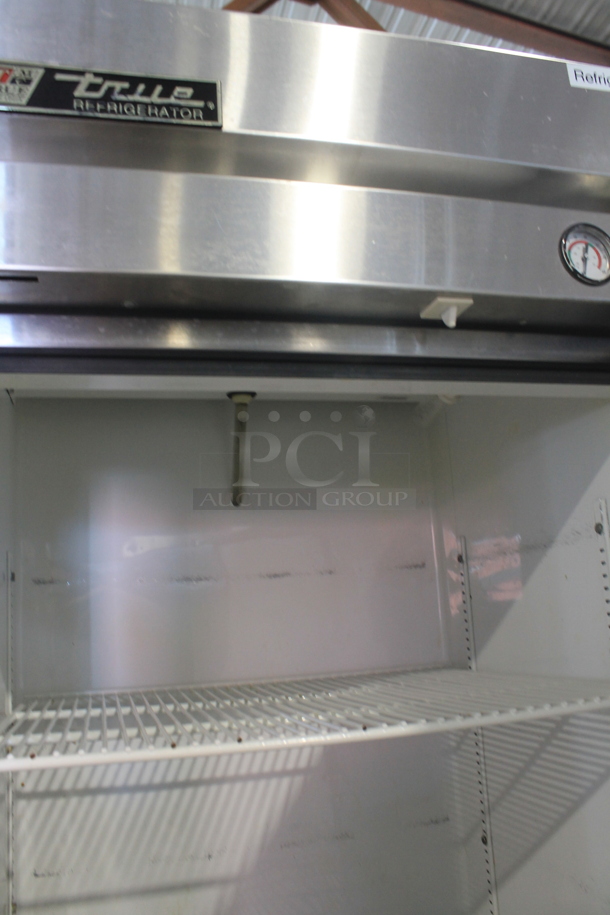 True T-19 Stainless Steel Commercial Single Door Reach In Cooler w/ Poly Coated Racks on Commercial Casters. 115 Volts, 1 Phase. Tested and Powers On But Does Not Get Cold
 - Image 4 of 5