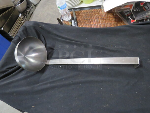One 32oz Stainless Steel Ladle.
