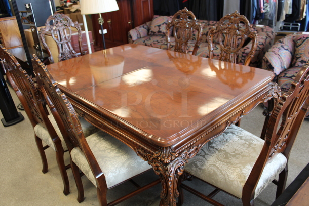 Hard Wood Victorian Style Dining Table w/ 6 Chairs and 2 Leaves.