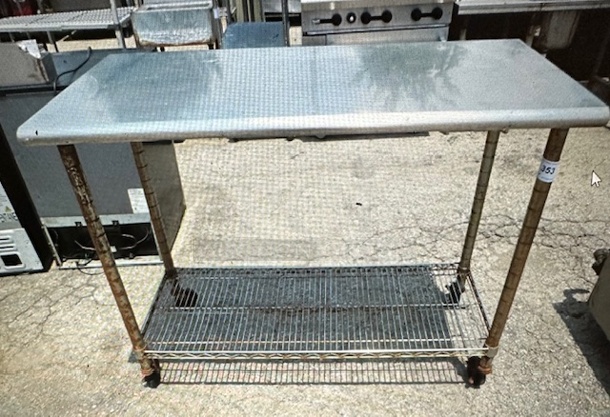 One Stainless Steel Table With A Metro Under Shelf On Casters. 49.5X24X39 - Image 1 of 1