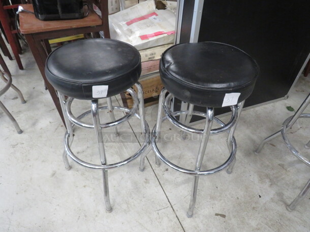 Double Chrome Ring Bar Stool With A Black Cushioned Swivel Seat. Need To Be Recovered. 2XBID - Image 1 of 1