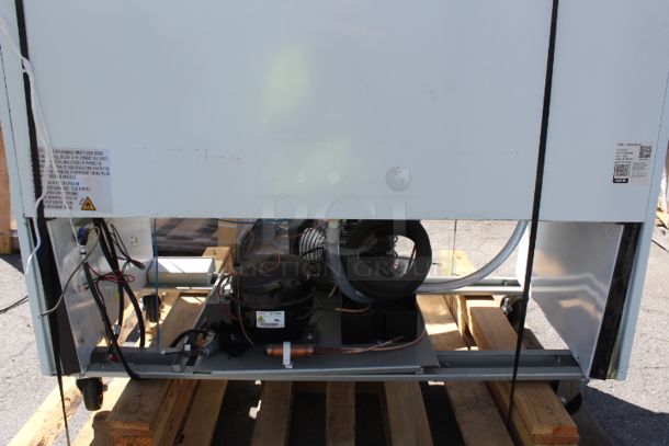BRAND NEW SCRATCH & DENT! Avantco GDC-40-HC 48" White Swing Glass Door Merchandiser Refrigerator with LED Lighting. Unit is badly dented on the back and front air grate covers.  Not tested. Wires are cut. S/N: 871987927 - Image 5 of 11
