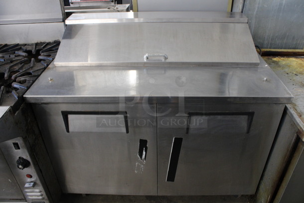 2011 True Model TSSU-48-12 Stainless Steel Commercial Sandwich Salad Prep Table Bain Marie Mega Top on Commercial Casters. 115 Volts, 1 Phase. 48x30x42. Tested and Powers On But Temps at 47 Degrees