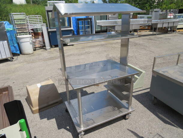 One Stainless Steel Table With SS Over Shelf, And SS Under Shelf, On Casters. 34X26X61.5 - Image 2 of 4