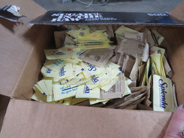 One Open Box Of Splenda/Raw Sugar.