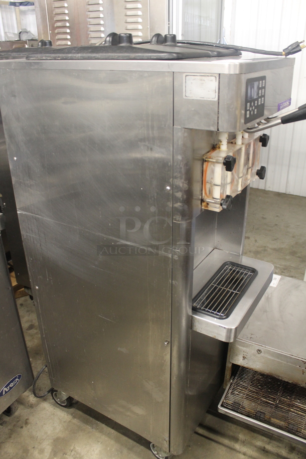 2011 Stoelting F231-18I2-OT2 Stainless Steel Commercial Floor Style Water Cooled 2 Flavor w/ Twist Soft Serve Ice Cream Machine on Commercial Casters. 208-240 Volts, 1 Phase.  - Image 2 of 6