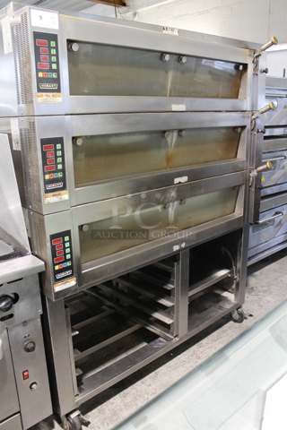 Hobart HWD03D Stainless Steel Commercial Electric Powered Triple Deck Bakery Oven on Pan Rack w/ Commercial Casters. 208 Volts, 3 Phase.