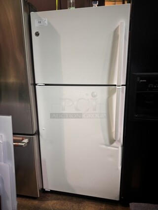 GE 30" Top/Bottom White Refrigerator. (Small Dent) , like new! 63" H x 30" W x 27" D