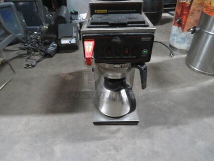 One Bunn Coffee Brewer With Filter Basket And Pot. Model# CWTF20. 115 Volt. 8X21X18