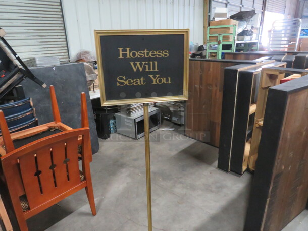 One Gold Color Sign. 15X10X60