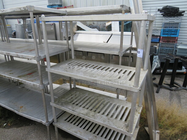 One Metal Shelving System With 4 Shelves. 36X17.5X60