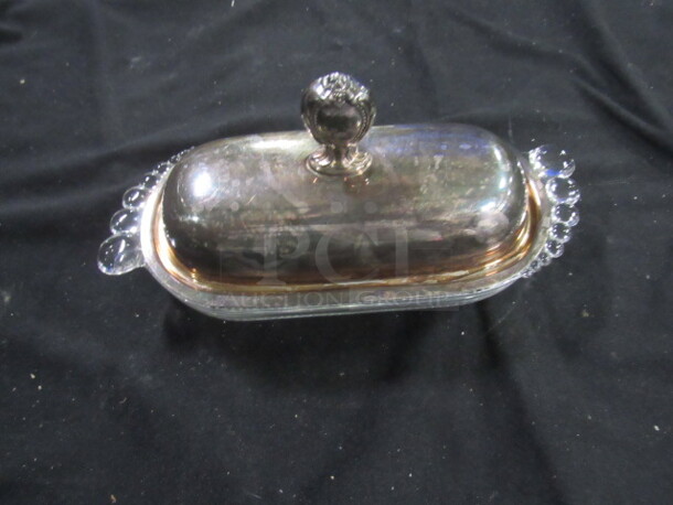 One Glass Butter Holder With Silver Lid.