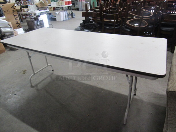 One Folding Table With Metal Legs And Laminate Top. 72X30X30