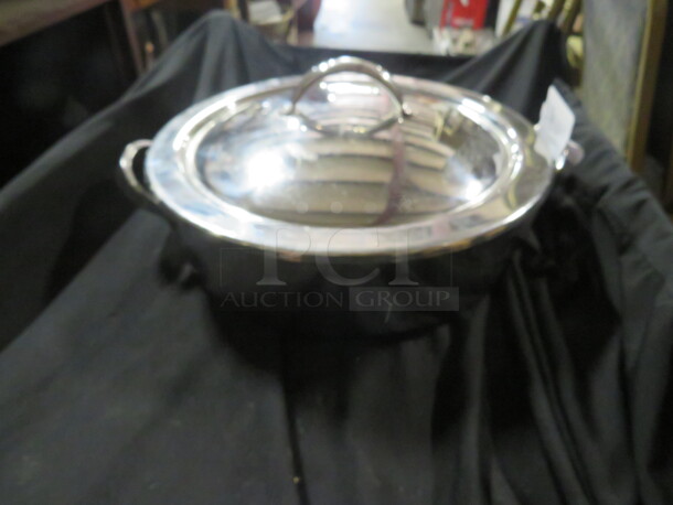 One 12 Inch Round Stainless Steel Pan With Lid.
