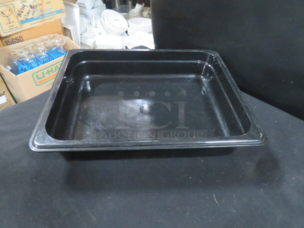 One Cambro 1/2 Size 2.5 Inch Black Food Storage Container. 