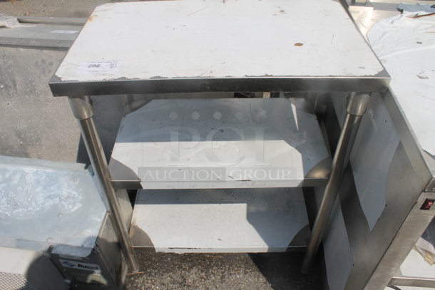 BRAND NEW SCRATCH AND DENT! Stainless Steel Commercial Table w/ 2 Under Shelves. - Image 1 of 3