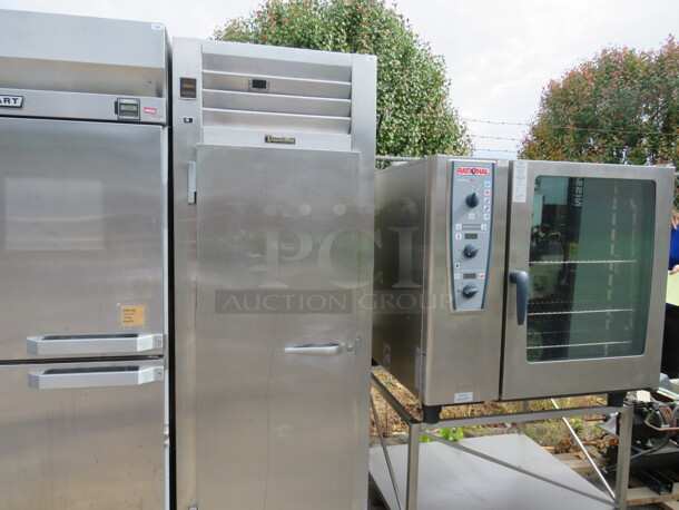 One Working Traulsen 1 Door Reach In Freezer With 3 Racks On Casters. Model# SG12011. 115 Volt. 30X35X83 - Image 1 of 2