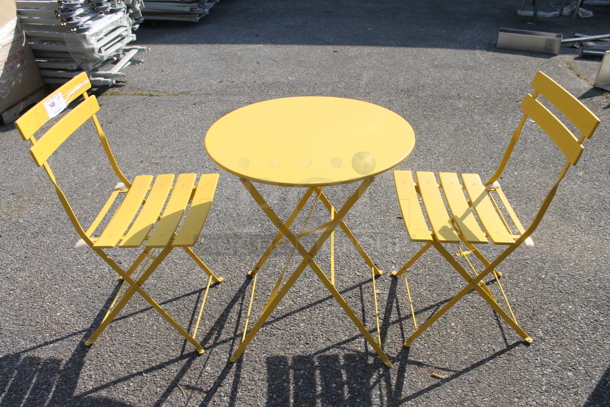 Yellow Metal Round Folding Table and 2 Yellow Metal Folding Chairs. 23.5x23.5x27.5, 16.5x14.5x32