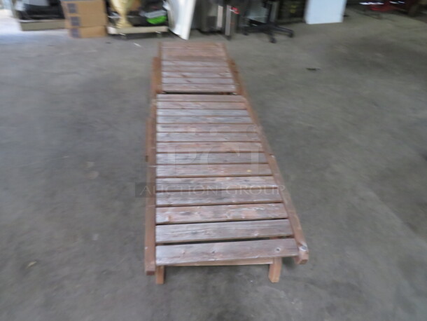 One Adjustable Wooden Chaise Lounger With 2 Wheels, And A Pullout Shelf. Needs A Lil Adjusting. 72X23 - Image 1 of 2