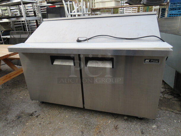 One Polar 2 Door Refrigerated Prep Table With Cutting Board And 2 Racks On Casters. Working When Removed.  Model# SCLMZ-60-E. 115 Volt. 60X34X46 - Image 1 of 3