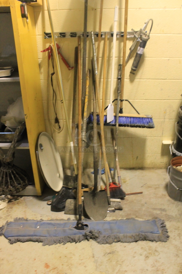 ALL ONE MONEY! Lot of Wall Mount Broom Holder w/ Contents Including Wide Mop and Push Broom. BUYER MUST REMOVE. - Image 1 of 3