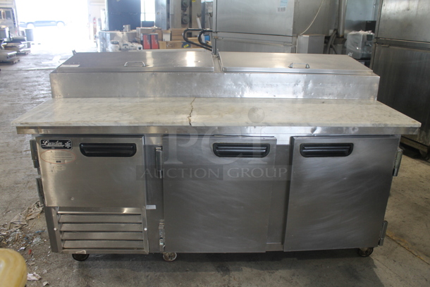 2014 Leader ESPT72SC Commercial Stainless Steel 3-Door Pizza Prep Table With Marble Style Countertop, Lift Up Lids, Plastic Drop-In Bins And Steel Racks On Commercial Casters. 115V. Tested and Powers On But Does Not Get Cold
