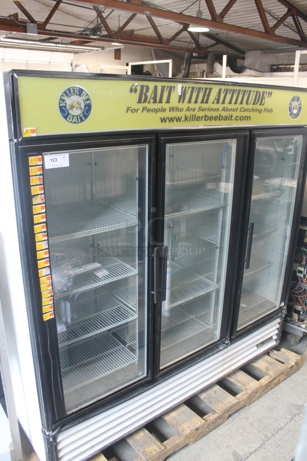 2012 True GDM-72F Commercial Three Swing Door Merchandiser Freezer With Polycoated Racks. 115/208-230V, 1 Phase. 