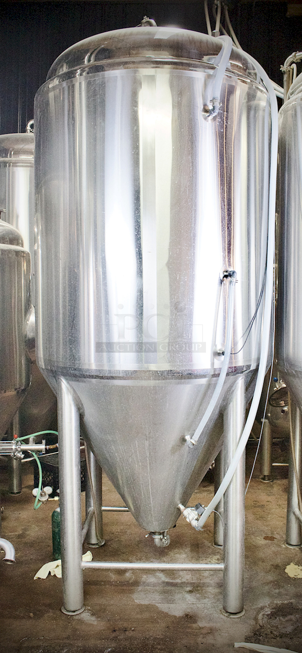 ? ? BEAUTIFUL!! Stout Tanks & Kettles - 15 BBL Fermenter / Unitank (Jacketed). ? ? Features: Easily Converts to a Unitank or Brite Serving Tank; Glycol Jacketed - 2 Zones: Cone and Sidewall; Shadowless Manway for Easy Cleaning; Adjustable Racking Arm for Clear Transfer; 1.5" Sample Valve for Quality Testing; Back Mounted Pressure Gauge; Adjustable Feet for Leveling on Uneven Floors or Fine Height Adjustments; Pressure Gauge Type: Back Mount; CIP Arm and 2.5" Rotating CIP Spray Ball; 2 Butterfly Valves; Rated to 2-Bar (29 PSI); 1/2" NPT Welded Thermowell for Contactless Temperature Probe Tank Thickness: 3mm Jacket and Outer Shell Thickness: 2mm. Cone: 60 degree Interior Angle. 51.5-in. diameter x 125-in.H. - Image 4 of 8