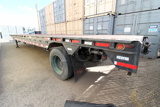 ROAD READY!! 40FT Steel Flatbed Tailer, 4 Wheels. 40FTx96".    VIN# 070F1283; Year 1970; Manufacturer Pike Trailer; Type Flatbed; Steel Construction; Length x Width 40' x 96"; Spring Ride Suspension; Location Single Fixed Axle; Tire Size LP 22.5; Wheel Construction Steel; Wheel Type Budd - Image 4 of 10