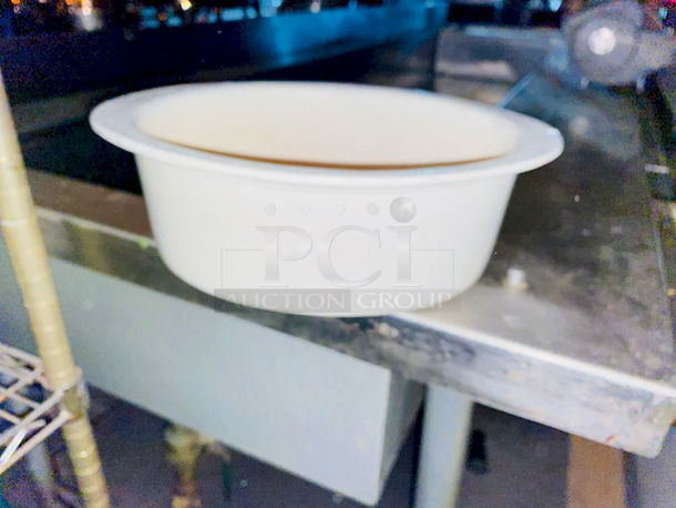DO NOT PASS THIS UP!! Shelf Full of (29) Bon Chef Bon Chef 5103PWHT 2.75 Qt. White Sandstone Finish Cast Aluminum Oval Food Pans.

Overall Dimensions:
Length: 12 3/8"
Width: 9 1/8"
Capacity: 2.75 qt.  - Image 1 of 4