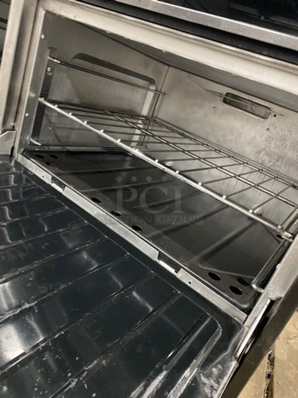 Commercial Natural Gas Powered 6 Burner Stove With Right Side Flat Griddle! Griddle Has Side Splashes! With Raised Back Splash And Salamander Shelf! With 2 Oven Underneath! Metal Oven Racks! All Stainless Steel! On Casters! - Image 6 of 11