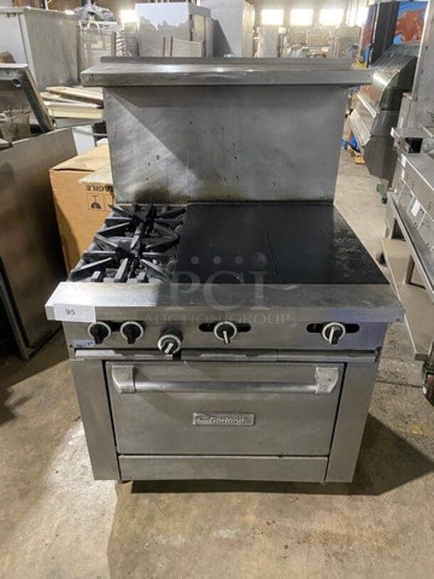 Garland Commercial Natural Gas Powered Hot Plate With Left Side 2 Burner Range! With Raised Splash Back And Salamander Shelf! With Oven Underneath! All Stainless Steel! On Legs! - Image 1 of 9