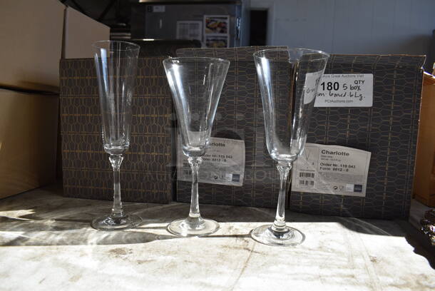 5 Boxes of BRAND NEW Glasses; Charlotte Champagne Glasses. 6 Small, 6 Medium and 6 Large. 3x3x10, 3.5x3.5x9, 4x4x9. 5 Times Your Bid!