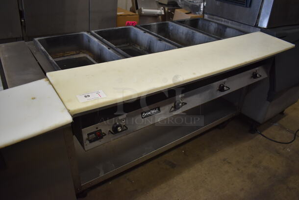Vollrath ServeWell 38004 Stainless Steel Commercial Electric Powered 4 Well Steam Table w/ Cutting Board and Under Shelf on Commercial Casters. 120/208-240 Volts, 1 Phase. 62x36x35