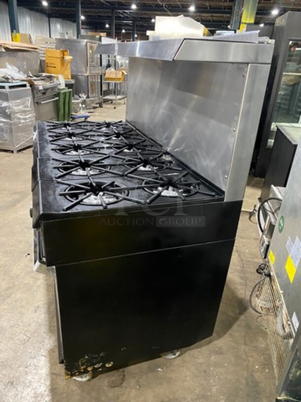 AMAZING FIND! Garland Natural Gas Powered 10 Burner Stove! With 2 Full-Sized Ovens! With Metal Oven Racks! With Raised Back Splash & Salamander Shelf! Stainless Steel! On Casters! - Image 2 of 11