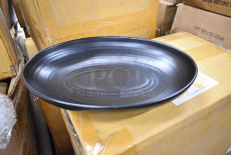 4 Boxes of 12 BRAND NEW IN BOX! Black Oval Ceramic Plates. 4 Times Your Bid!