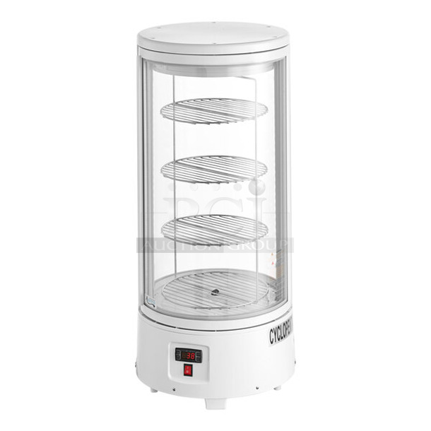 BRAND NEW SCRATCH AND DENT! Avantco 360CRR2HCW Metal Commercial Countertop White Countertop Rotating Refrigerated Cake Display. Door Will Not Stay Shut. 110-120 Volts, 1 Phase. Tested and Working!