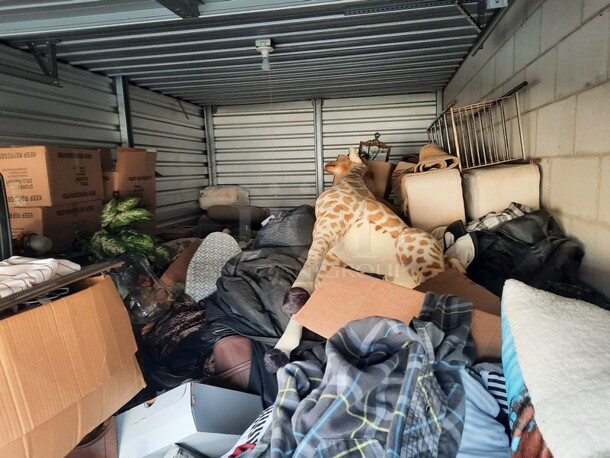 ALL ONE MONEY! Lot of Entire Contents of Storage Unit #29. Unit Size: 10 x 20. Unit Appears to Contain: Dressers, Bookshelves, Box Spring & Mattress, Wooden Bed, Couch, Chairs, Tables, Fan, Heaters, Bottle of Buttons, Longaberger Baskets, Lights, Mirror, Ironing Board, Rugs, Suitcases, Trashcan, Keurig, Blankets, Clothes, Shoes, Kerosene Heater, Large Stuffed Giraffe, Fake Plants, Bags, Totes & Boxes. Cleaning Deposit of $100 per Unit Paid on Pickup Day. Winner Has 7 Days From Close of Auction to Remove Items. All Items Must Be Removed and Unit Must Be Broom Swept to Get Cleaning Deposit Returned. Invoice and Cleaning Deposit Must Be Paid In Full by 4:00pm Tuesday, March 7th. Unit Must Be Cleared Out By 4:00pm Monday, March 13th. Please Come Into The Office To Settle Your Invoice and You Will Be Taken To Your Storage Unit for Cleanout. If You Plan To Clear Out Your Unit Saturday or Sunday You Need To Report To Our Office During The Week Before 4:00pm To Gain Access To Your Unit As Our Office Is Closed On Weekends. - Image 8 of 12
