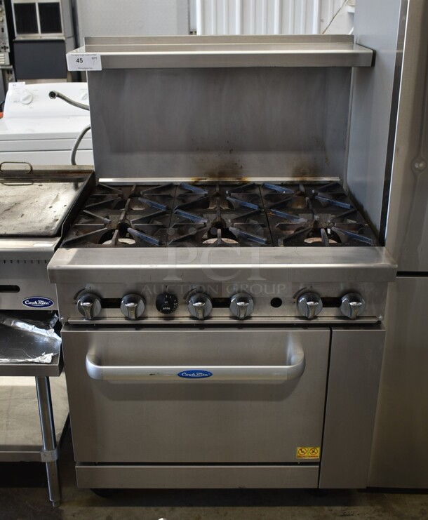 Cook Rite Stainless Steel Commercial Propane Gas Powered 6 Burner Range w/ Oven, Over Shelf and Back Splash on Commercial Casters. 