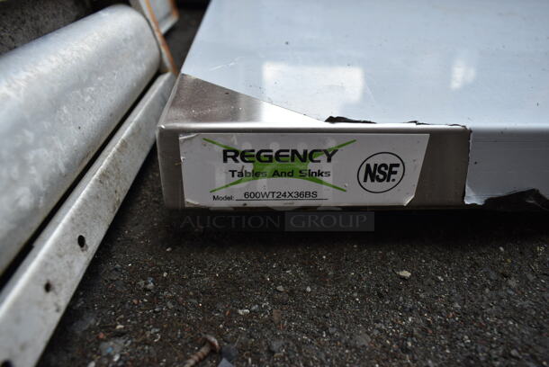 BRAND NEW SCRATCH AND DENT! Regency 600WT24X36BS 24" x 36" 16-Gauge 304 Stainless Steel Commercial Open Base Work Table with 4" Backsplash. No Legs. - Image 3 of 3