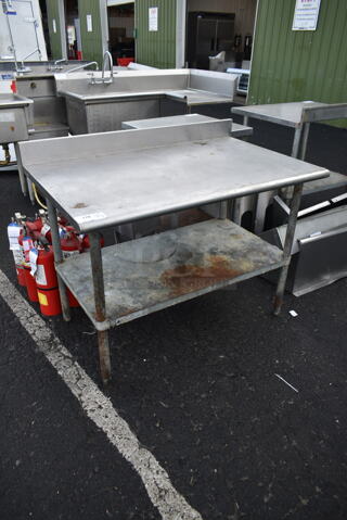 Stainless Steel Commercial Table w/ Back Splash and Under Shelf.