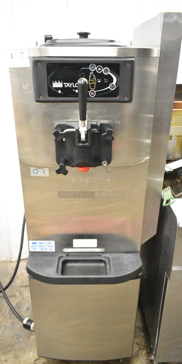 Taylor C709-27 Stainless Steel Commercial Floor Style Air Cooled Single Flavor Soft Serve Ice Cream Machine on Commercial Casters. 208-230 Volts, 1 Phase.  - Image 1 of 7